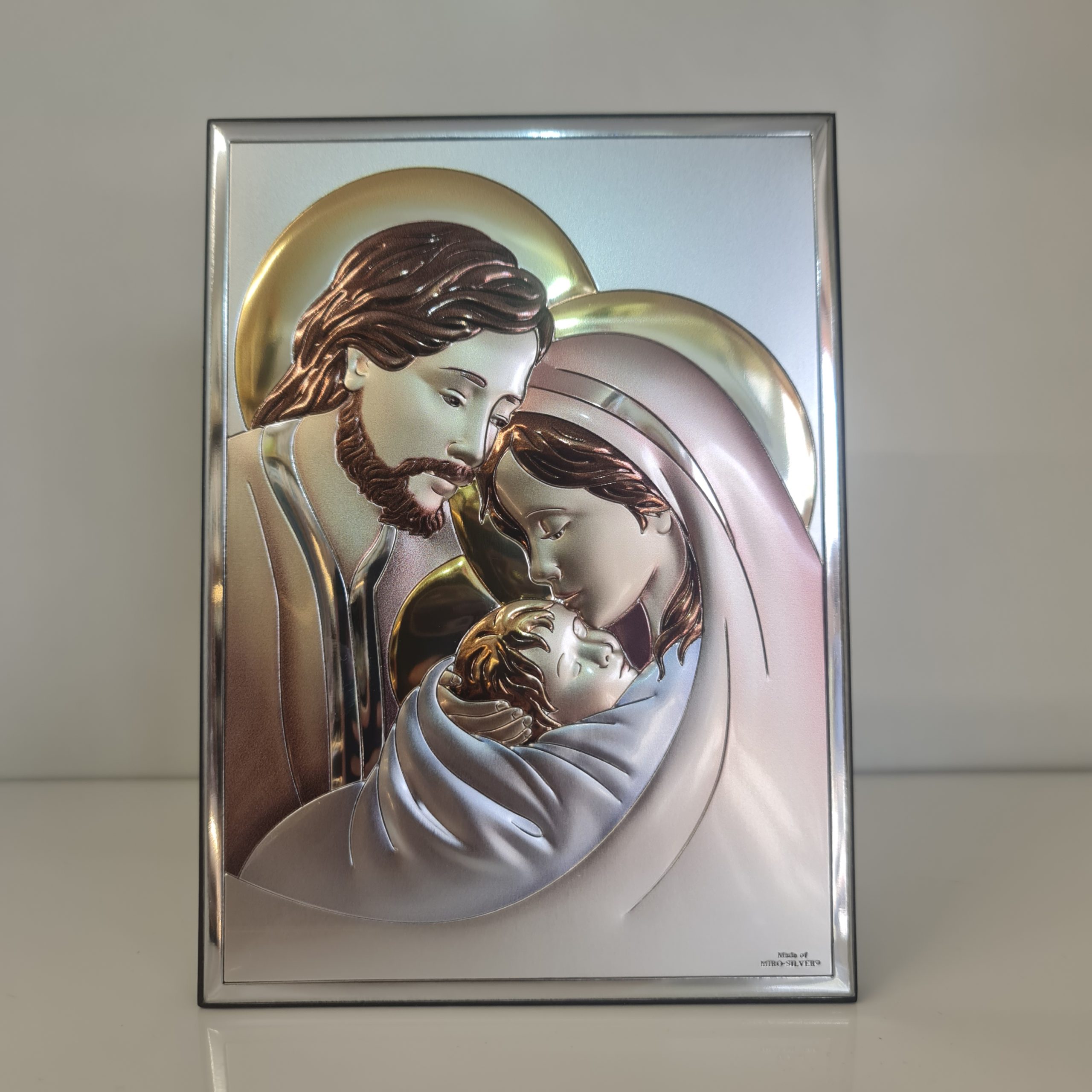 Holy Family silver plaque on wood, rectangular.