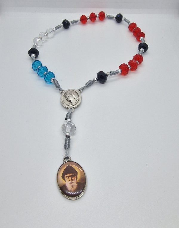 a beaded necklace with a religious image